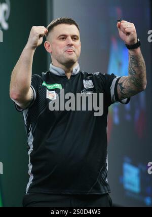 London, UK. 27th Dec, 2024. Luke Woodhouse celebrating winning his 3rd round match against Damon Heta during the PDC Paddy Power World Darts Championship 2024/2025 at Alexandra Palace, London, England, United Kingdom on 27 December 2024 Credit: Every Second Media/Alamy Live News Stock Photo