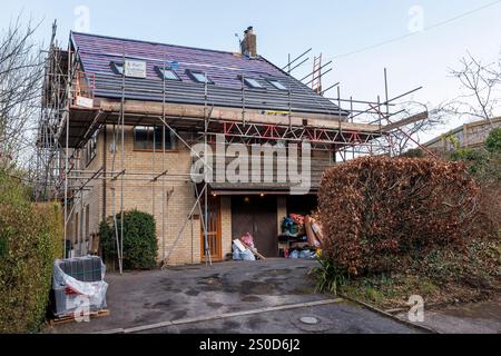Scaffolding on house having its roof tiles replaced, Llanfoist, Wales, UK Stock Photo