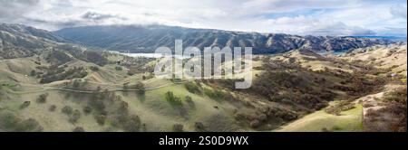 Sunlight shines on the rolling hills near Del Valle regional park in Livermore, California. This scenic area lies just east of San Francisco Bay. Stock Photo