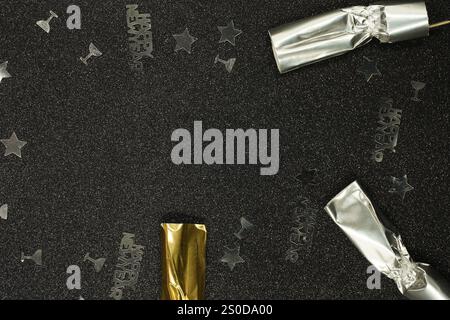 Bright festive decorations with colorful crackers and sparkling embellishments set against a New Year's celebration theme, symbolizing holiday joy and Stock Photo