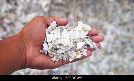 Pvc plastic recycling, Male hand holding pvc plastic shredding flakes, Pp wash grinding Stock Photo