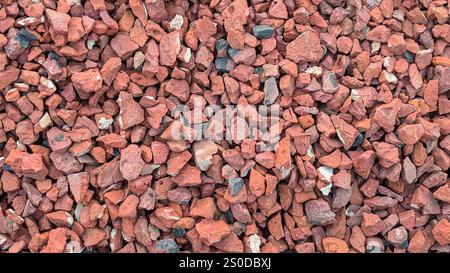 Small pieces of red clay bricks or Aggregates of bricks for making concrete Stock Photo