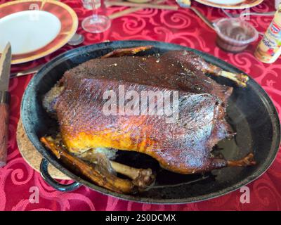 Christmas roast brown crispy duck on the holiday table food image Stock Photo