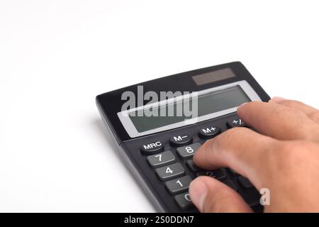 Hands holding and using a calculator isolated on a white background Stock Photo