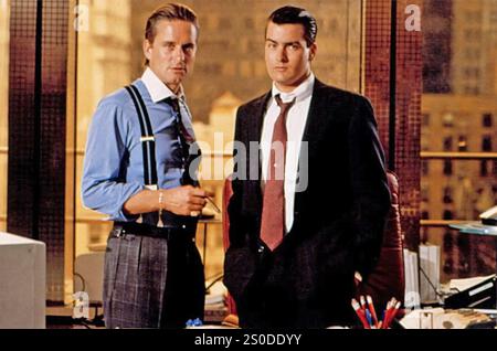 WALL STREET  1987 20th Century Fox film with Michael Douglas at left as Gordon Gekko  and Charlie Sheen as Bud Fox Stock Photo