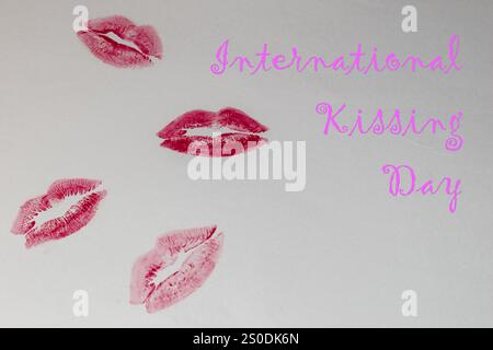 Pink and magenta lipstick imprints on a light background, international kissing day concept Stock Photo