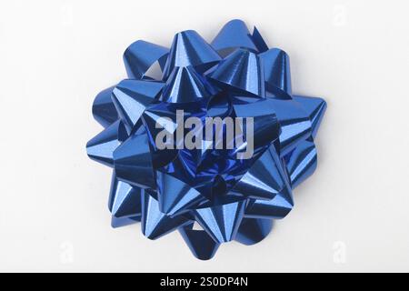 Top view of decorative blue gift bow against white background Stock Photo