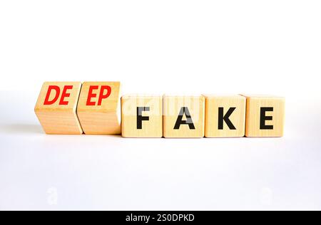 Deepfake or fake symbol. Concept words Fake Deepfake on wooden cubes. Beautiful white table white background. Business and deepfake or fake concept. C Stock Photo