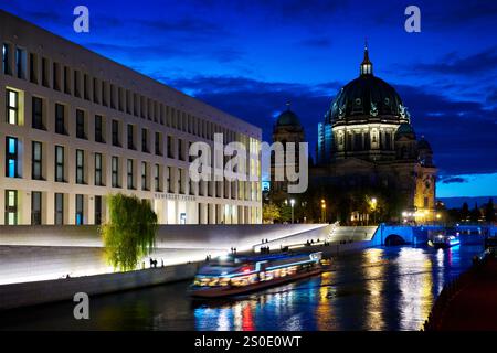 Berlin, Germany – September 27, 2024 - Berlin Cathedral Night Spree River Cruises. The Berlin Cathedral and the Humboldt Forum or City Palace. Stock Photo