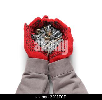 Worker's hands holding pile of different tap bolts, chrome nuts and screws on white background Stock Photo