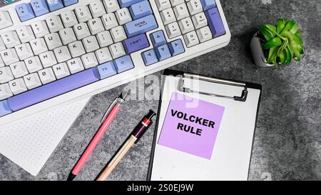 Concept of Volcker Rule write on sticky notes isolated on Wooden Table. Stock Photo