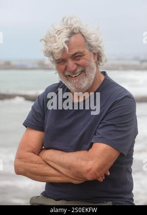portrait of a senior man  smiling with ocean in background Stock Photo