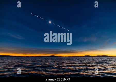 Sequence of the total eclipse of the Sun over the waters of Lac-Brome, Quebec, Canada. Stock Photo