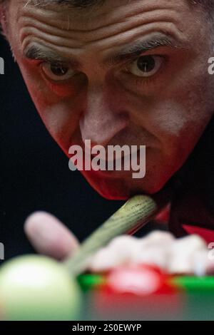 Beijing, China. 27th Dec, 2024. Ronnie O'Sullivan of England plays a shot during the match against Si Jiahui of China at 2024 Macao Snooker Masters in south China's Macao, Dec. 27, 2024. Credit: Cheong Kam Ka/Xinhua/Alamy Live News Stock Photo