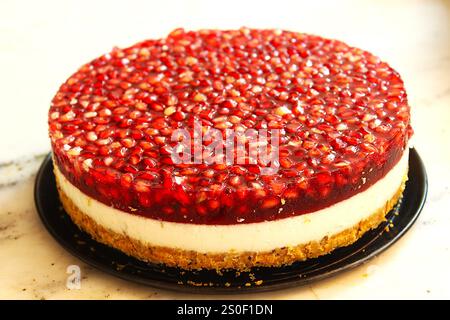 A delicious cheese cake.we have it for our celebration.specially at Yalda night.we bake desert and slads and fruts slice with pomegranate.Yalda naight is an Iranian traditional for longest night of year. Stock Photo