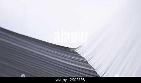 Stack of blank white papers or pages in a book. Photographed diagonally from above with focus on the corner. Background photo Stock Photo