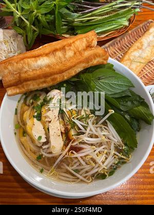 Pho chicken Noodle soup with fried bread Stock Photo