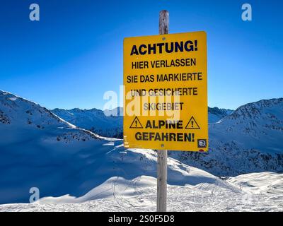 Warning sign about alpine dangers Stock Photo - Alamy