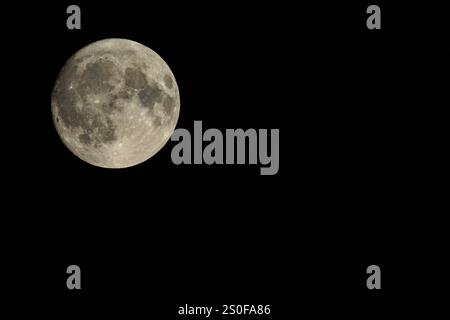 Full moon against a black sky with copy space Stock Photo