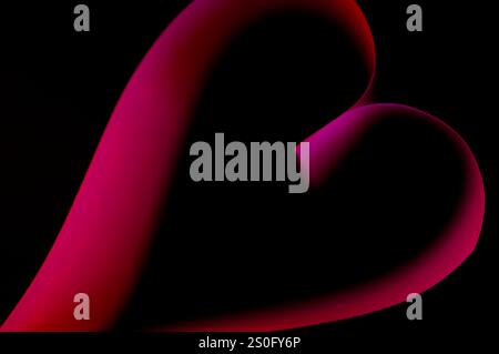 Pink glowing light on a heart shape Stock Photo