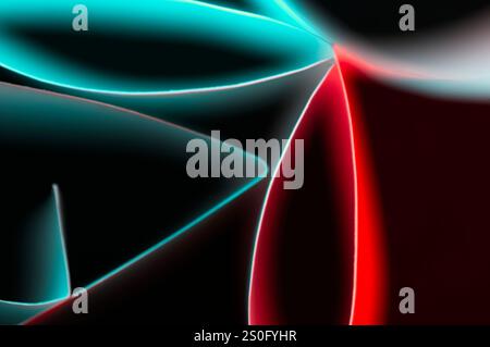 Glowing neon tubes in an abstract of red and blue on black Stock Photo