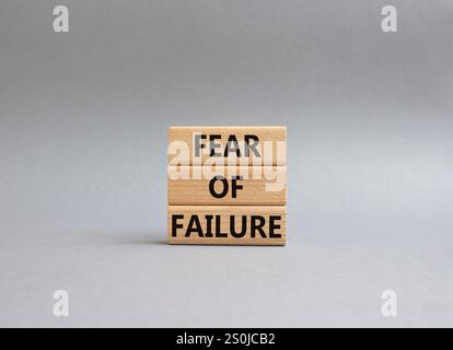 Fear of failure symbol. Concept words Fear of failure on wooden blocks. Beautiful grey background. Business and Fear of failure concept. Copy space. Stock Photo