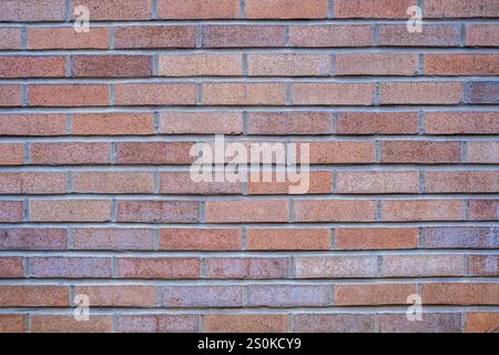 Background from a wall made of reddish clinker bricks Stock Photo