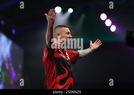 Alexandra Palace, London, UK. 28th Dec, 2024. 2024/25 PDC Paddy Power World Darts Championships Day 11; Nathan Aspinall raising his arms towards the spectators before playing his third round match against Andrew Gilding Credit: Action Plus Sports/17�Թ����� Live News Stock Photo