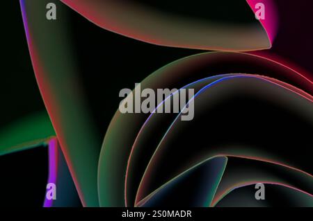 Various lines and shapes in an abstract display of colors on a black background Stock Photo