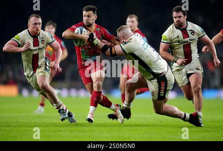 Harlequins' Danny Care (left) is tackled by Leicester Tigers' Joe Heyes during the Gallagher Premiership match at the Allianz Stadium, London. Picture date: Saturday December 28, 2024. Stock Photo