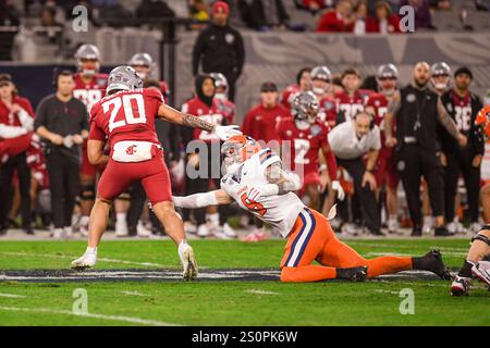 Commandres Running Back Washington State running back Leo Pulalasi carries the ball during the ...