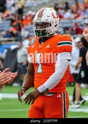 Miami quarterback Cam Ward (1) warms up before the Pop Tarts Bowl NCAA