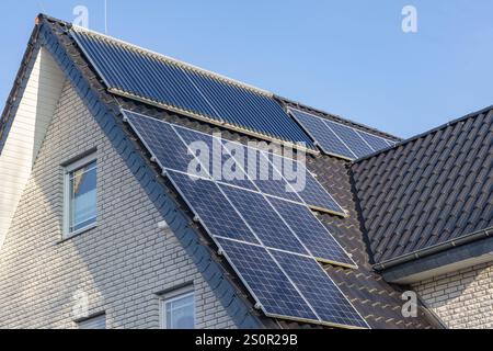 Roof of two-family house with solar collectors and vacuum tube ...
