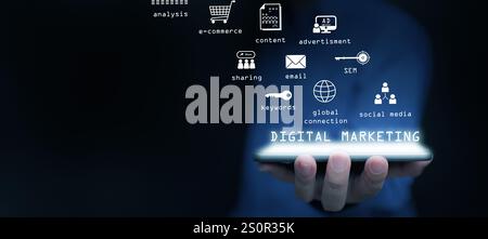 Digital marketing and advertising. A man using online advertisement and digital ad, many icons on virtual screen, using his tablet computer. Stock Photo