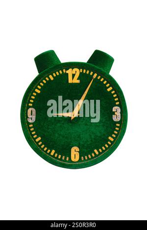 A green vintage-style alarm clock with yellow hands and numbers, showing the time as 12:15, isolated on a white background. Stock Photo