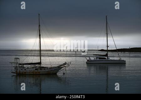 two sail boats rest at their moorings in Nelson, New Zealand Stock Photo