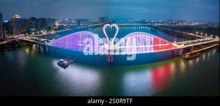 Beijing, China. 27th Dec, 2024. This stitched aerial drone photo taken on Dec. 27, 2024 shows Echeng (nickname of Huizhou, meaning 'the city of goose') Bridge in Huizhou, south China's Guangdong Province. The 1,119.5-meter-long Echeng Bridge was put into operation on Saturday. Credit: Zeng Kaigang/Xinhua/Alamy Live News Stock Photo