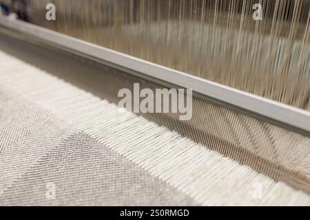 Industrial textile weaving machine in a weaving factory, industrial concept background, Stock Photo