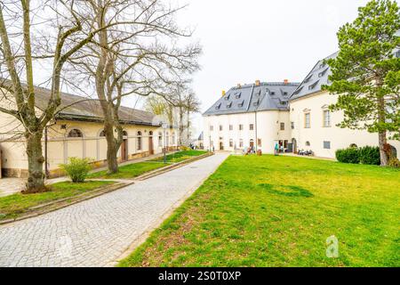 The Konigstein Fortress, a monumental structure in Saxony, Germany, showcases its impressive architecture and beautiful surroundings, inviting visitors to explore its rich history and scenic views. Stock Photo