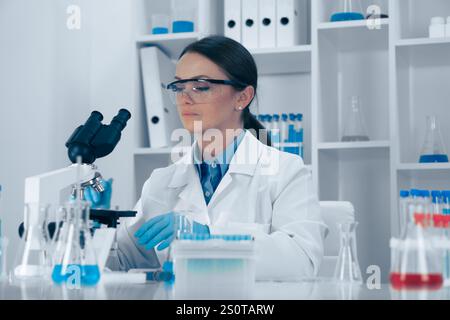 A dedicated scientist analyzes samples in a stateoftheart lab using precise techniques to achieve reliable results, significantly contributing to Stock Photo