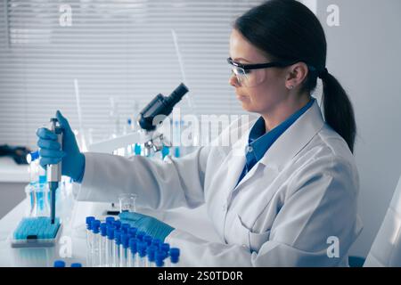 A dedicated scientist is conducting experiments in a modern laboratory with cuttingedge technology, showcasing their expertise and commitment to Stock Photo