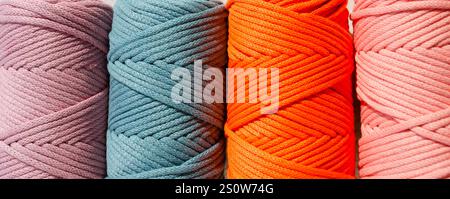 Colored skeins of thread for weaving macrame close-up. Cotton threads of Turkish production. Stock Photo