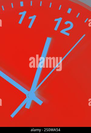 Close-up of hands on red blue clock face Stock Photo