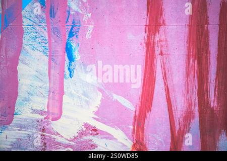 Messy paint strokes and smudges on an old grunge wall background. Creative modern urban city background with pink, magenta, white color drips, flows Stock Photo