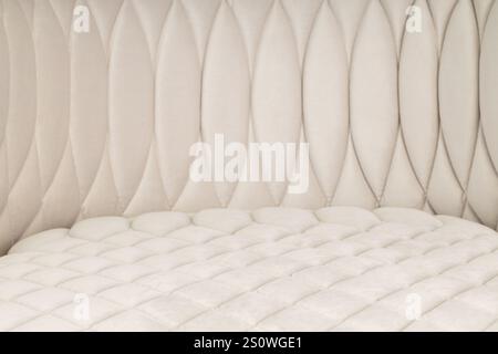 Quilted Upholstery with Textured Design in Beige Stock Photo