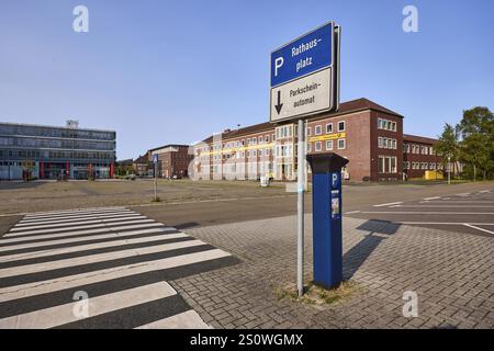 Signpost to car park, parking ticket machine, zebra crossing, brick architecture, tree, blue cloudless sky, Paul-Hug-Strasse and town hall square, Wil Stock Photo