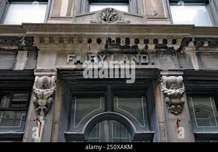 The facade of the historic James Fairie Building, also called the Phoenix Insurance Building, in Old Montreal bears the name Fairy Land. Stock Photo