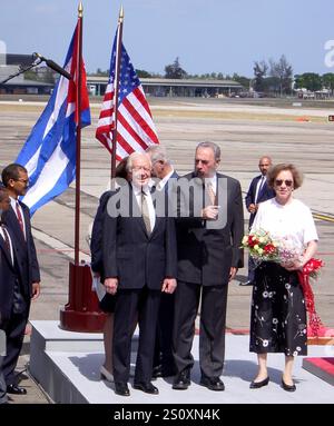 Former U.S. President Jimmy Carter (L) talks with Cuban President Fidel Castro during a welcoming ceremony at 'Jose Marti' International airport in Havana, May 12, 2002. Carter is on a six-day visit to Cuba, and is the first American president to visit the communist island since Fidel Castro took power in 1959. Credit: Jorge Rey/MediaPunch Stock Photo