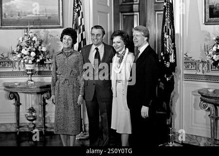 From left to right: Joan Mondale, United States Vice President Walter Mondale, first lady Rosalynn Carter and US President Jimmy Carter, pose for a group photo in the Blue Room of the White House in Washington, DC on the first full day of the Carter-Mondale Administration on January 21, 1977.Credit: Barry A. Soorenko / CNP / MediaPunch Stock Photo