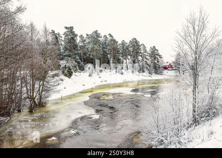 River with ice in a wintry landscape Stock Photo